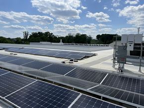 Arlington apartment for rent - A large array of solar panels are installed on a roof.
