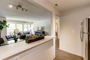 Fort Belvoir apartment for rent - A kitchen with a white counter and a refrigerator.