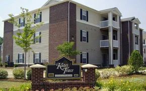 Newport News apartment for rent - A brick building with a sign that says Kates Trace in front of it.