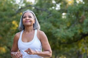 Arlington apartment for rent - A woman in a white tank top is running outdoors.