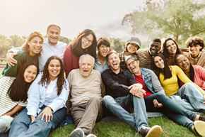 Alexandria apartment for rent - A group of people sitting on the grass in a park.