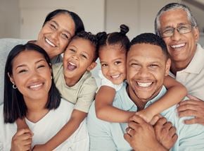 Silver Spring apartment for rent - A family of five is smiling and hugging together.