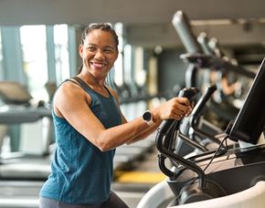 Silver Spring apartment for rent - A woman is working out on a treadmill in a gym.