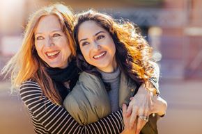Silver Spring apartment for rent - Two women hugging each other in an outdoor setting.