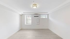 Arlington apartment for rent - A white room with a window and a door.