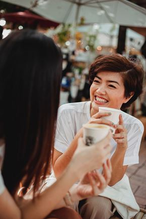 Baltimore apartment for rent - Two women having a conversation over a cup of coffee.