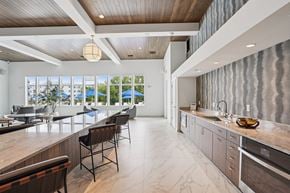 Madison apartment for rent - A modern kitchen with a long counter and chairs.
