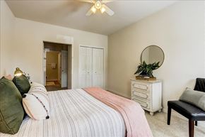 Madison apartment for rent - a bedroom with a bed and a mirror