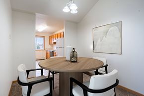 Fargo apartment for rent - A dining room with a round table and chairs. Fargo, ND Summit Point Apartments