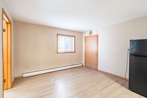 Fargo apartment for rent - A room with a window and a door. Fargo, ND Birchwood Apartments