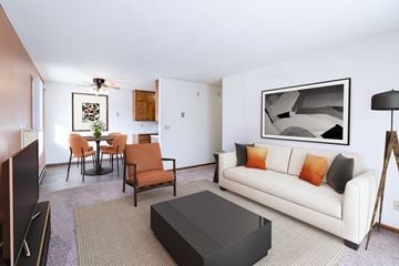 Fargo apartment for rent - A living room with a white couch and a black coffee table.