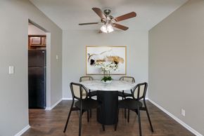 Omaha apartment for rent - A dining room with a table set for four. Omaha, NE Evergreen Terrace Apartments