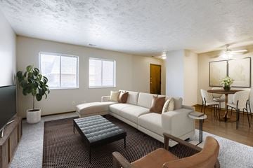 Omaha townhouse for rent - A living room with a white couch and a black coffee table.