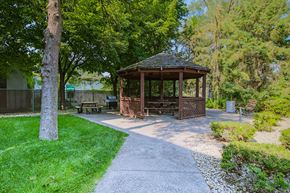 Anoka apartment for rent - Anoka, MN Dellwood Estates Apartments. a gazebo in a park with trees