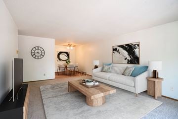 Fargo apartment for rent - A living room with a white couch and a wooden coffee table.