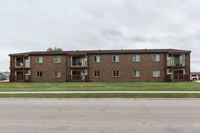 Crookston apartment for rent - Grand Forks, ND Barrette Arms Apartments. a large brick apartment building with balconies