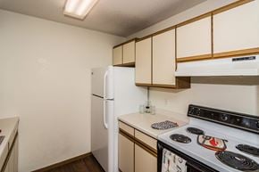Grand Forks apartment for rent - Grand Forks, ND Bristol Park Apartments. a kitchen with white cabinets and a white stove top oven
