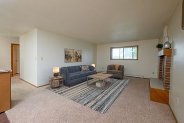 Fargo apartment for rent - an open living room with couches and a coffee table