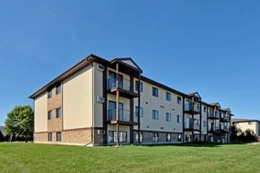 Fargo apartment for rent - the exterior of an apartment building on a sunny day. Fargo, ND Chestnut Ridge Apartments