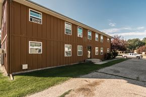 Grand Forks apartment for rent - Grand Forks, ND Claremont Apartments. brick exterior of the two-level apartment building