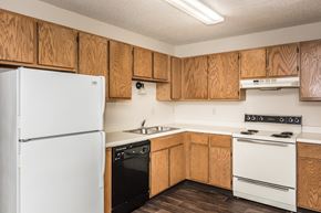 Grand Forks apartment for rent - Grand Forks, ND Columbia West Apartments. a kitchen with white appliances and wooden cabinets