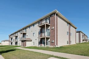 Fargo apartment for rent - an apartment building with a sidewalk in front of it. Fargo, ND Country Edge Apartments