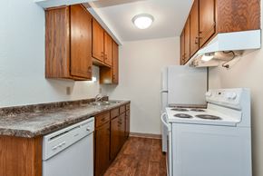 White Bear Lake apartment for rent - White Bear Lake, MN White Bear Terrace Apartments.  a kitchen with white appliances and wooden cabinets