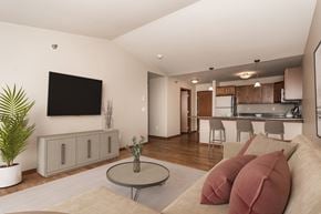 Grand Forks apartment for rent - Apartments. a living room with a couch and a table  at Sterling Pointe, Grand Forks, 58201
