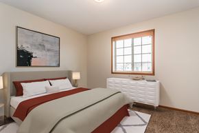 Grand Forks apartment for rent - a bedroom with a bed and a window  at Sterling Pointe, Grand Forks, 58201