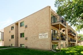 Fargo apartment for rent - the exterior of a three level building. Fargo, ND Park Terrace Apartments