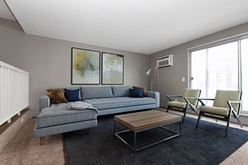 Roseville apartment for rent - a living room with grey couches and a coffee table