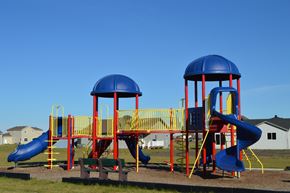 Moorhead apartment for rent - a playground with multiple slides. Moorhead, MN Sandy Creek Apartments