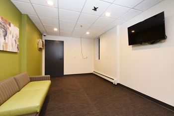 The edge of uptown apartments | laundry facilities lounge area