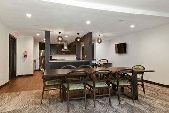 The edge of uptown apartments | community room dining area