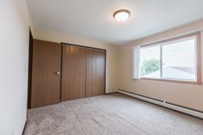 Crookston apartment for rent - Grand Forks, ND Twin Drive Apartments. A bedroom with carpet and a window