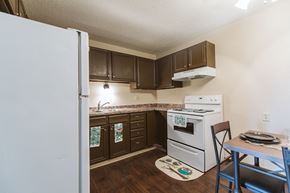 Crookston apartment for rent - Grand Forks, ND Twin Drive Apartments. A kitchen with white appliances.