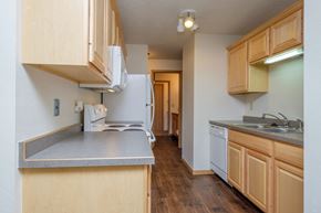 Fargo apartment for rent - A kitchen with white appliances. Fargo, ND Windgate Apartments.
