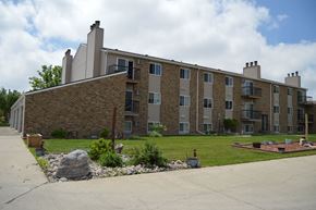 Fargo apartment for rent - An exterior of a brick apartments building. Windgate Apartments | Fargo, ND