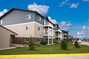 Fargo apartment for rent - our apartments are located on the corner of a street with grass