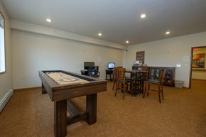 Fargo apartment for rent - a community room with games and tables. Fargo, ND North Sky Apartments