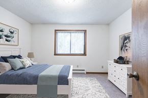 Bismarck apartment for rent - Bismarck, ND Arbor apartments. a bedroom with a bed and a dresser