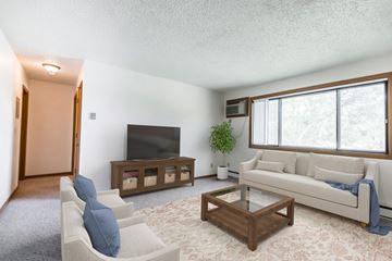 Bismarck apartment for rent - a living room with a white couch and a television