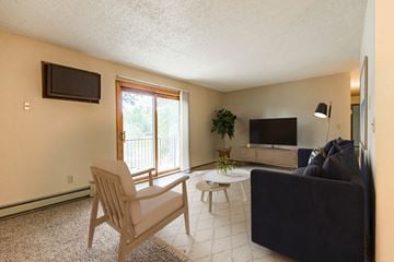 Bismarck apartment for rent - a living room with a couch and a chair and a television