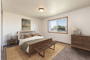 Bismarck apartment for rent - Bismarck, ND Brentwood II Apartments. A bedroom with a large bed and a large window