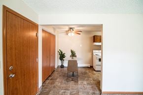 Bismarck apartment for rent - A dining room with a table and a ceiling fan. Bismarck, ND Eastbrook Apartments.