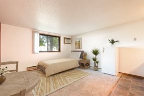 Bismarck apartment for rent - Mandan, ND Garden Grove Apartments.  a bedroom with a bed and a table
