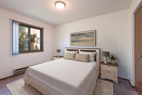 Bismarck apartment for rent - Mandan, ND Garden Grove Apartments. A bedroom with a bed and two night stands