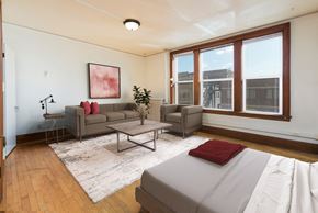 Bismarck apartment for rent - Bismarck, ND Mason Apartment. The space showcases a comfortable living area and a relaxing sleeping area. It's a compact and inviting living space designed for convenience and comfort.