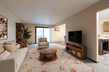 Bismarck apartment for rent - a living room with a couch and a chair and a television
