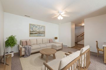 Bismarck apartment for rent - a living room with a couch and a table and a ceiling fan